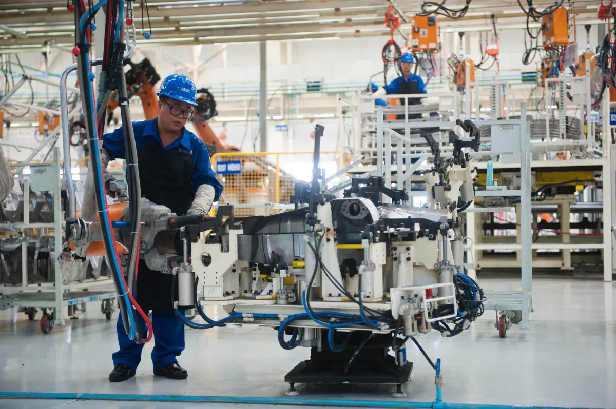 Employees working in the Chang'an automobile factory in Beijing on August 16, 2012. (AFP/GettyImages)