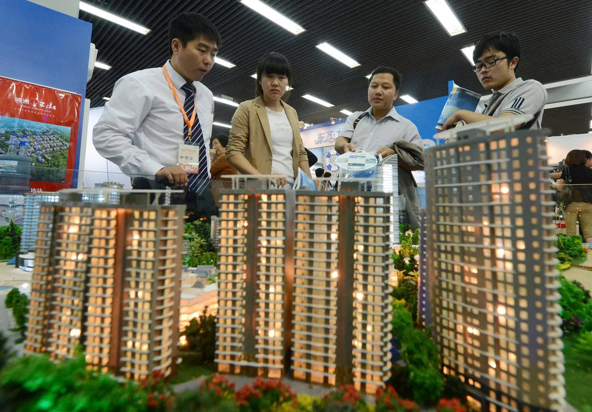 People view a model of a property development being sold at an investment show in Beijing on Sept. 20, 2012.  (Mark Ralston/AFP/GettyImages)