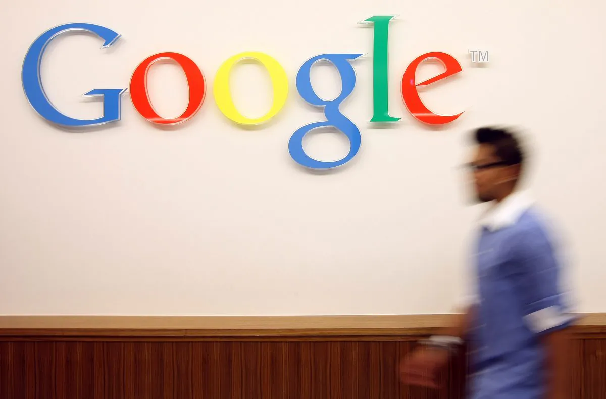 A visitor passes the Google logo at the Google offices in Berlin, Germany. (Adam Berry/Getty Images)