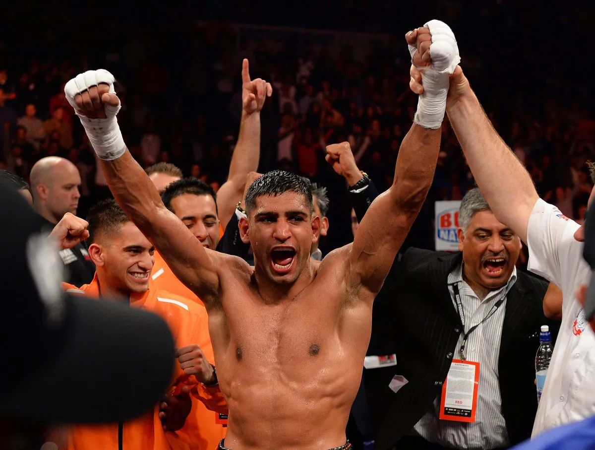 Amir Khan of Great Britain (C) reacts after defeating Julio Diaz of Mexico during their 143lbs Catchweight Contest at the Motorpoint Arena in Sheffield, England on April 27, 2013. (ANDREW YATES/AFP/Getty Images)

