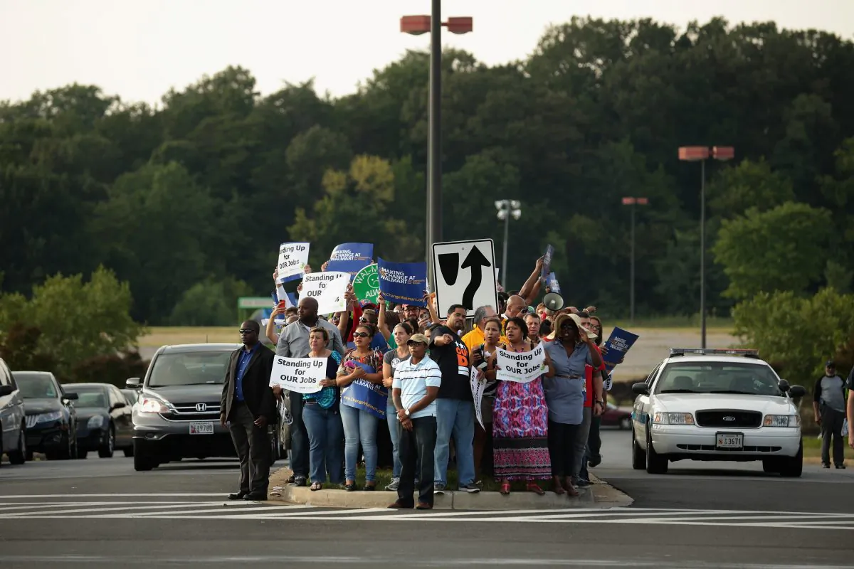 Hundreds of demonstrators march and block traffic in a major intersection outside a Walmart store Sept. 5, 2013 in Hyattsville, Maryland, to protest the retail giant's labor practices. (Chip Somodevilla/Getty Images)