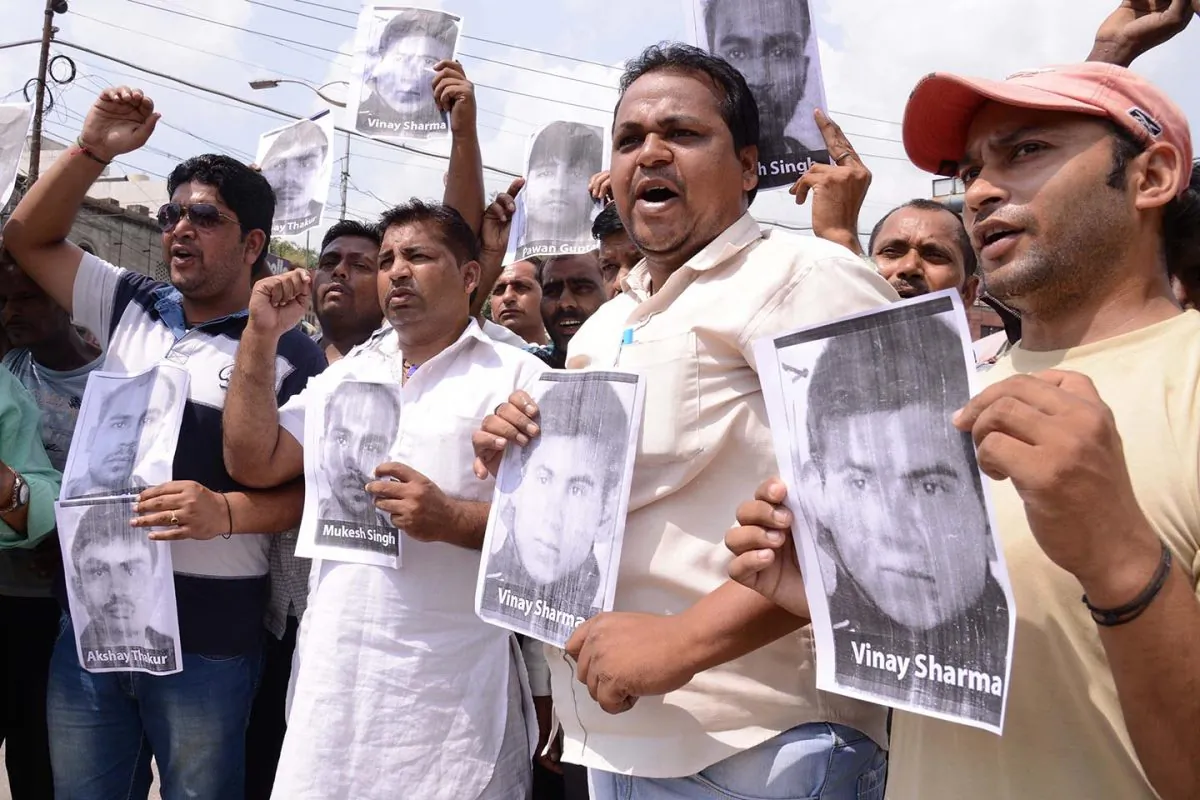 Protesters shout slogans as they hold posters of accused in a gang rape case of a student in New Delhi during a demonstration in Amritsar on September 11, 2013. 
Activists blame the Indian media sensationalized the case and wrongly portrayed the juvenile as the most brutal attacker. (Narinder Nanu/AFP/Getty Images)