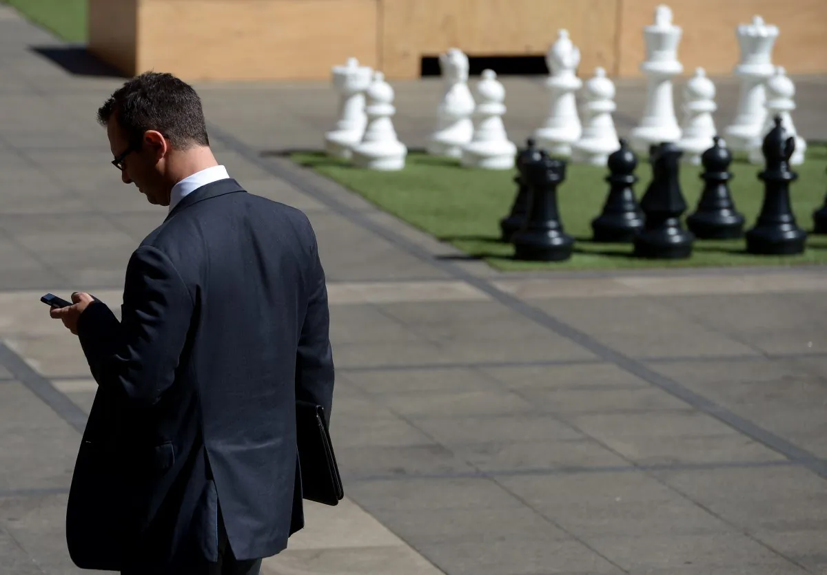 A businessman makes a call in the central business district of Sydney on Sept. 12, 2013. The unemployment rate, now at a seven year low, signals that more job seekers are giving up looking. (Greg Wood/AFP/Getty Images)