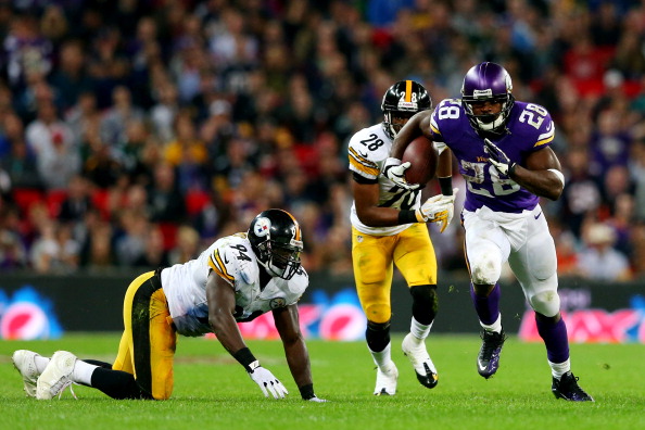 Running back Adrian Peterson #28 of the Minnesota Vikings beats cornerback Cortez Allen #28 of the Pittsburgh Steelers and inside linebacker Lawrence Timmons #94 of the Pittsburgh Steelers during the NFL International Series game between Pittsburgh Steelers and Minnesota Vikings at Wembley Stadium on September 29, 2013 in London, England.  (Photo by Julian Finney/Getty Images)