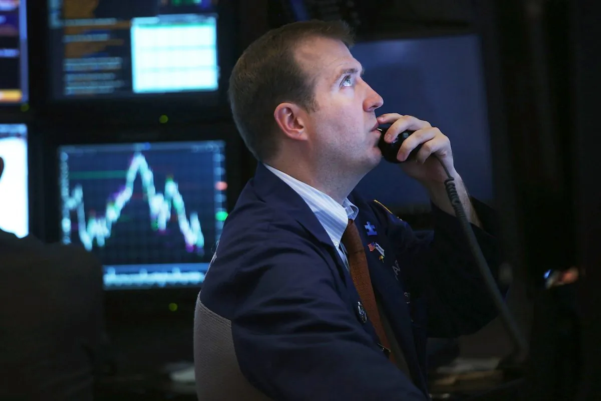 A floor trader works at the New York Stock Exchange, Oct. 3. (Spencer Platt/Getty Images)