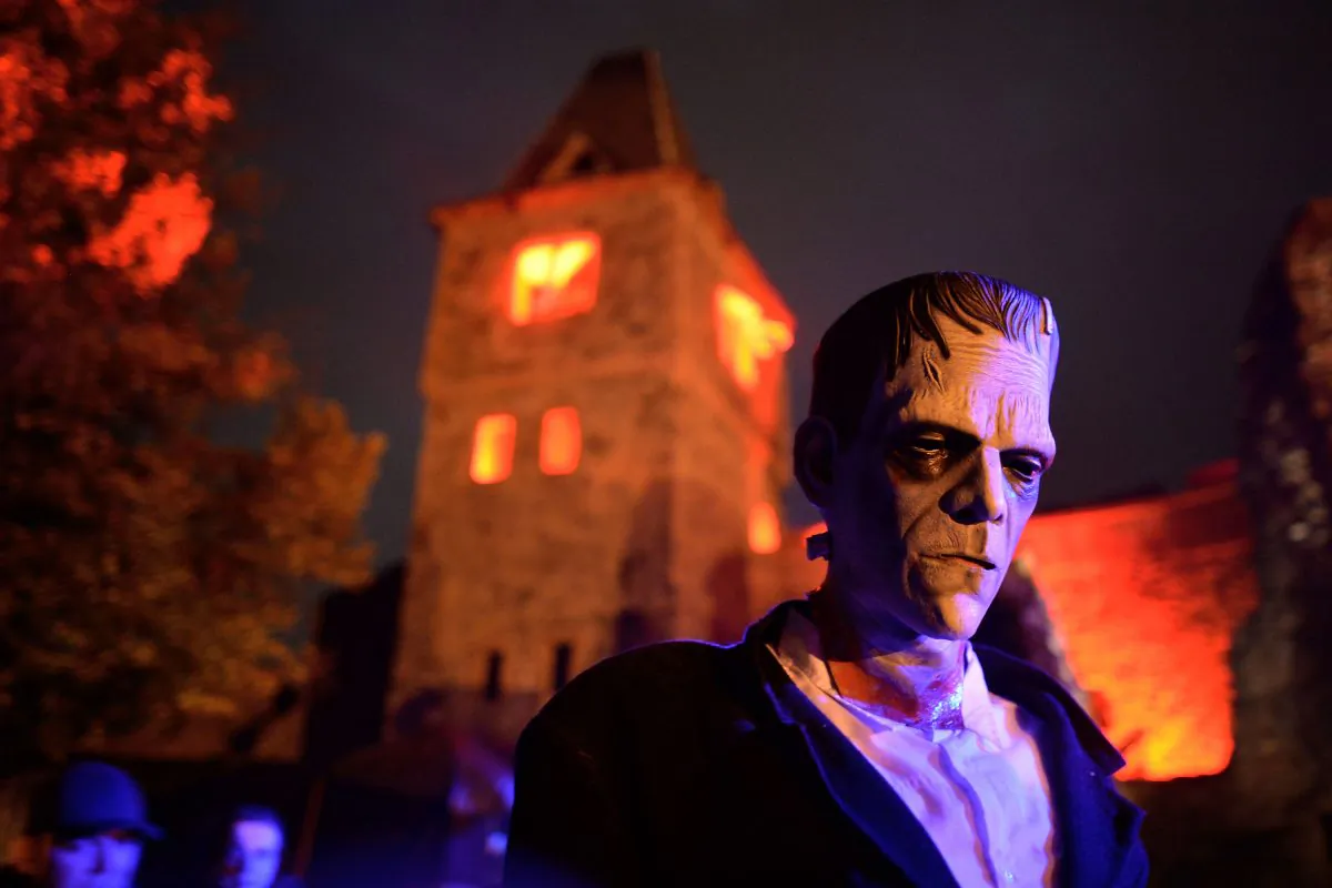 A person dressed as Dr. Victor Frankenstein's monster tries to scare visitors at Frankenstein castle on October 19, 2013, in Darmstadt, Germany. The Frankenstein monster and its creator have roots with a real-life doctor that performed Frankenstein-like experiments over 150 years ago. (Thomas Lohnes/Getty Images) 