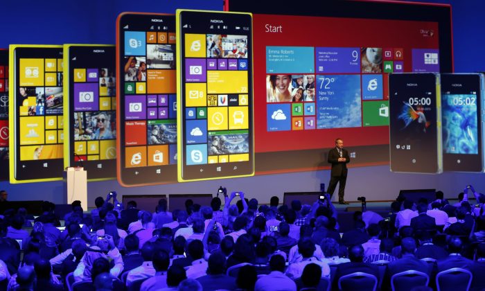 Stephen Elop unveils Nokia's latest products during an event in Abu Dhabi, Oct. 22. (KARIM SAHIB/AFP/Getty Images)
