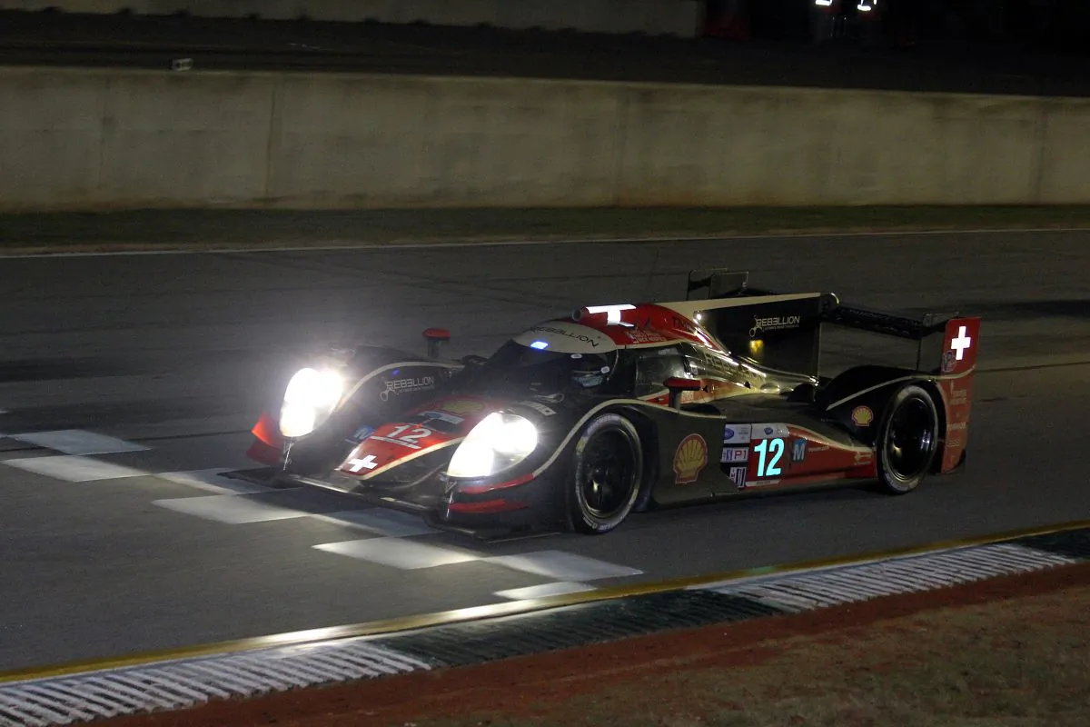 The winning #12 Rebellion Lola-Toyota crosses the finish line at Road Atlanta during the 16th—and final—American Le Mans Series Petit Le Mans endurance race. (Chris Jasurek/Epoch Times)