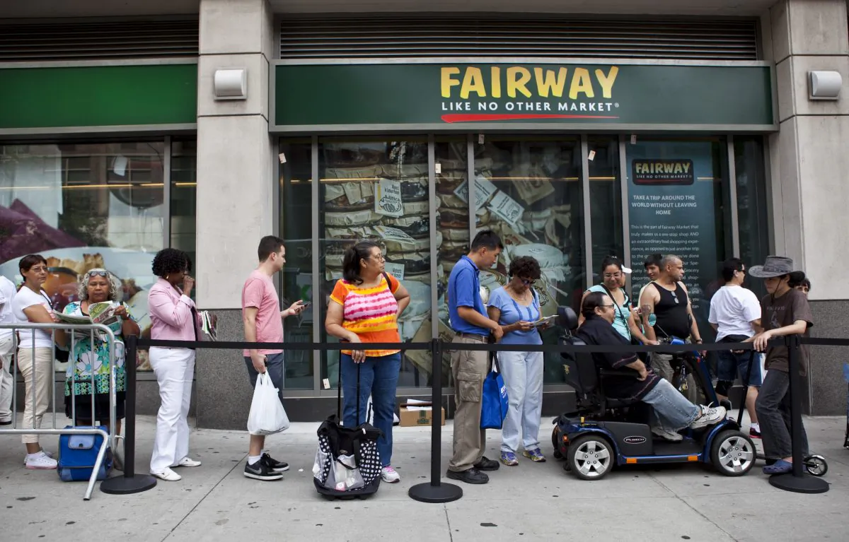 People wait in line for the new Fairway Market to open in Chelsea on Sixth Avenue, July 24. Fairway is opening a Downtown store in 2014.(Samira Bouaou/Epoch Times)