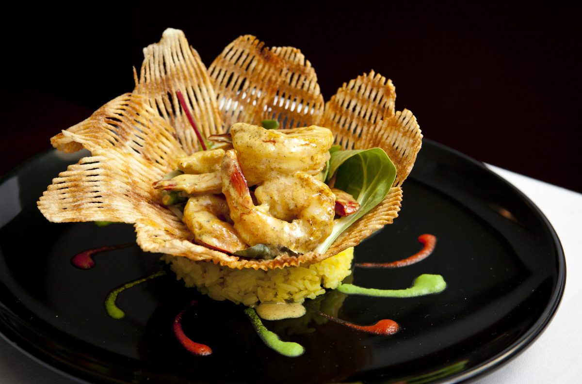 Sauteed shrimp au curry Bengal on a bed of rice at Paname, a French bistro on the Upper East Side. (Samira Bouaou/Epoch Times) 