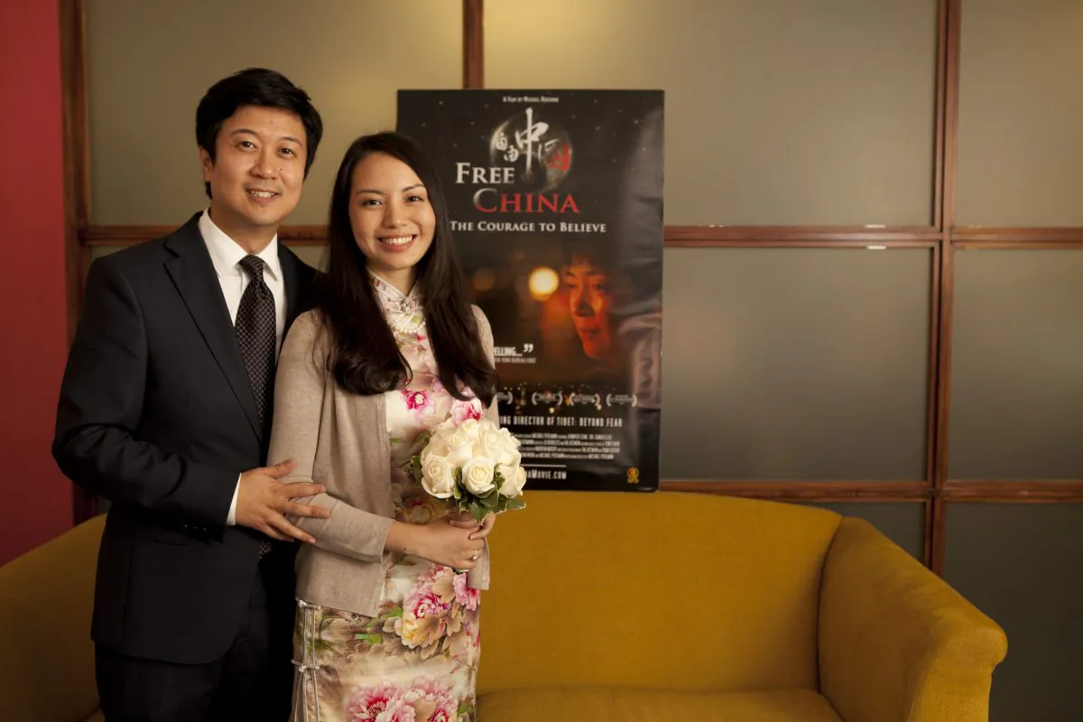 Kean Wong (L) , producer of "Free China: The Courage to Believe," with his wife, Xixi Deng, on their wedding day, shortly before the screening of Free China at NTD Television headquarters in New York City, Oct. 10, 2013. (Samira Bouaou/Epoch Times)
