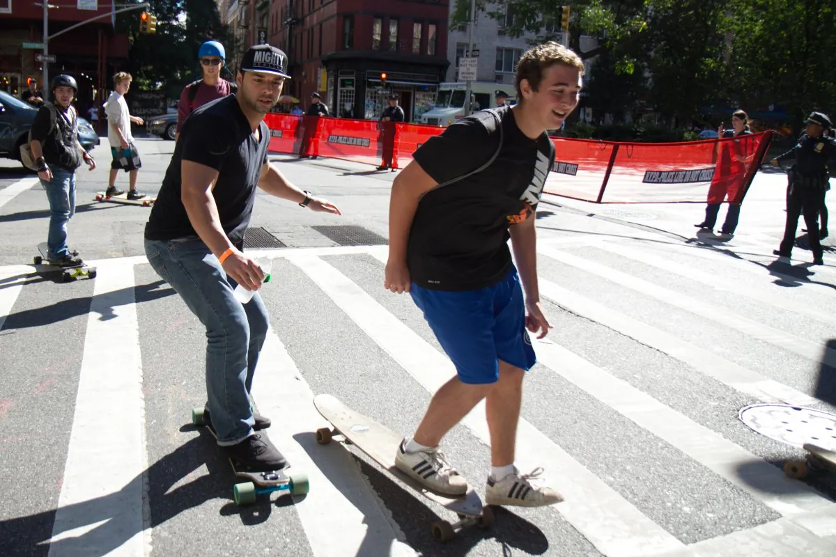 
The NYPD redirects skateboarders from riding down Broadway in their annual "Broadway Bomb." Skaters gather every year 116th Street and ride down Broadway all the way to Wall Street in New York City. (Benjamin Chasteen/Epoch Times)
