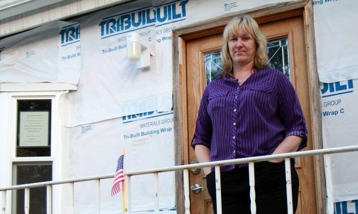 Deirdre Young-McGrath stands outside her home in New Dorp Beach, Staten Island, New York, on Oct. 15, 2013. (Ivan Pentchoukov/Epoch Times)
