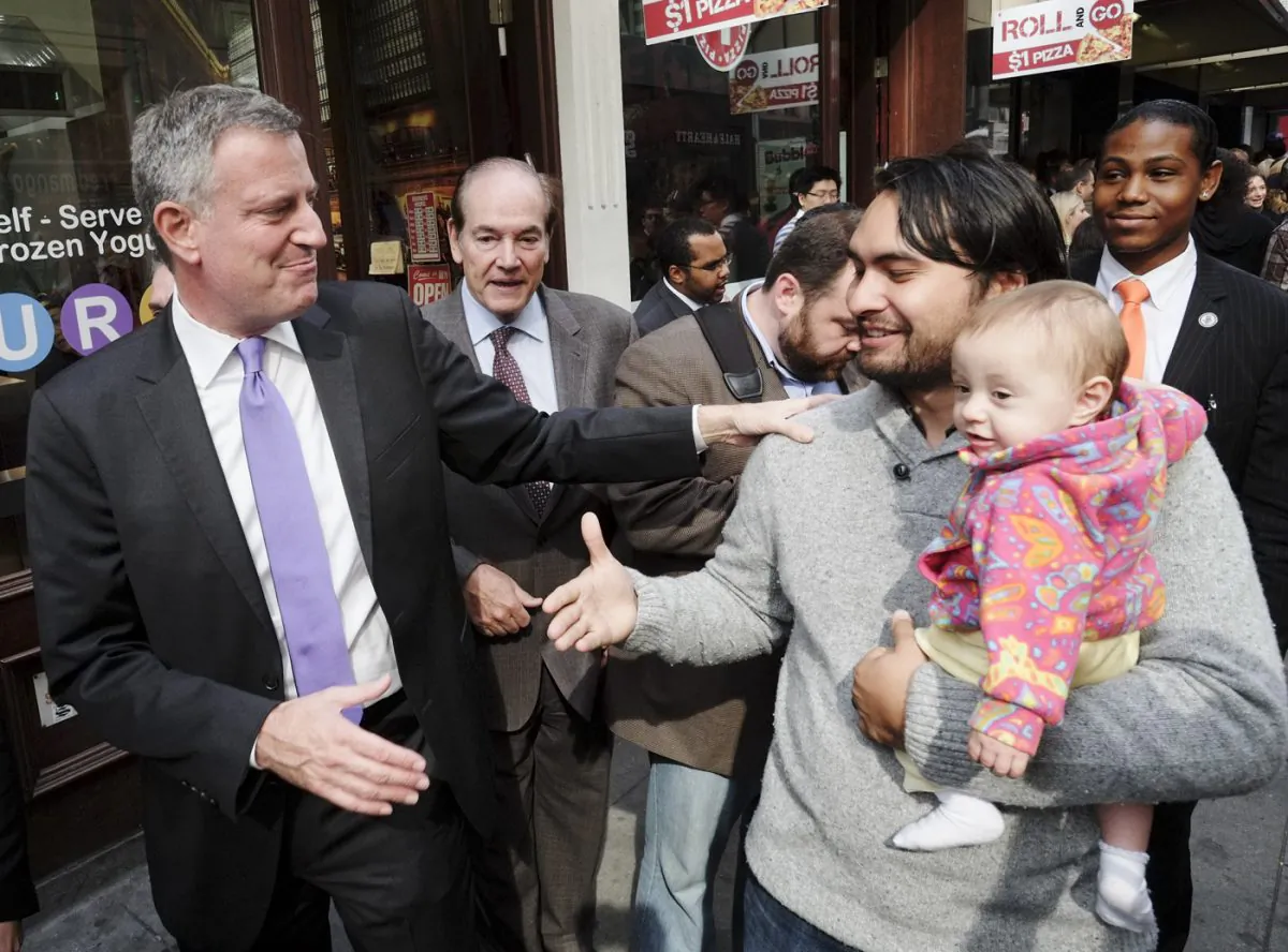 Bill de Blasio speaks to New York Communities for Change Organizing Director Jonathan Westin outside a Downtown Manhattan Burger King, New York, Oct. 16, 2013. (Photo submitted anonymously)
