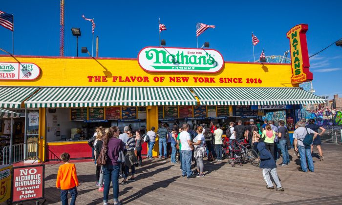 Customers wait in line for a hot dog from Nathan's Famous on Coney Island, Brooklyn, New York, Oct. 17, 2013. (Petr Svab/Epoch Times)