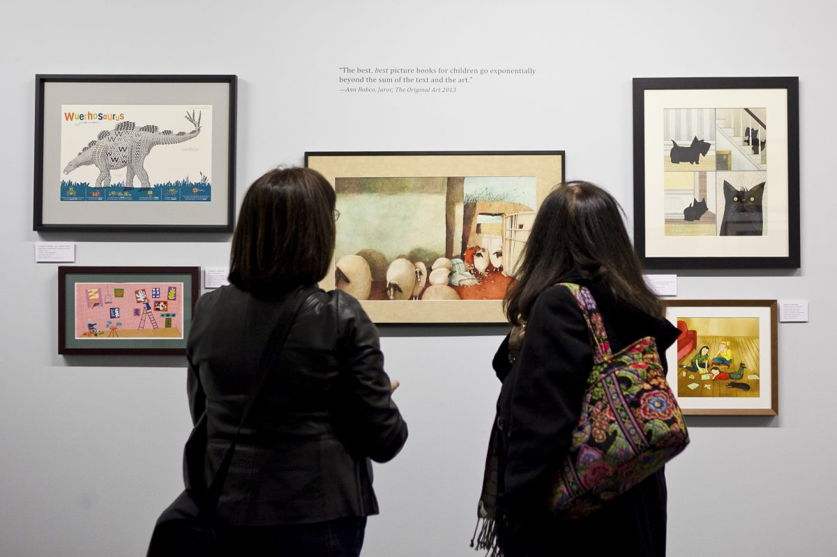 Visitors view this year's Original Art exhibit at the Society of Illustrators. (Samira Bouaou/Epoch Times)

