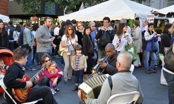 Visitors enjoy life music at the 2010 Lower East Side Pickle Day Festival. The annual Pickle Day this Sunday will feature world-renowned picklers, a home pickling contest with celebrity judges, live music, the Cucumber, vendors, games, and other family activities. (Ethan Ries)