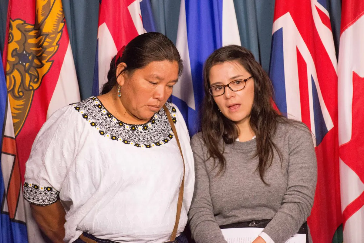 Valeria Scorza (R), deputy director for Mexican mining NGO Prodesc, translates for Angelica Choc, whose husband was killed by security staff at HudBay Minerals Fenix Mining Project in Guatemala. Choc, along with 13 other Mayan Guatemalans, is suing HudBay in a Canadian court. (Matthew Little/Epoch Times)