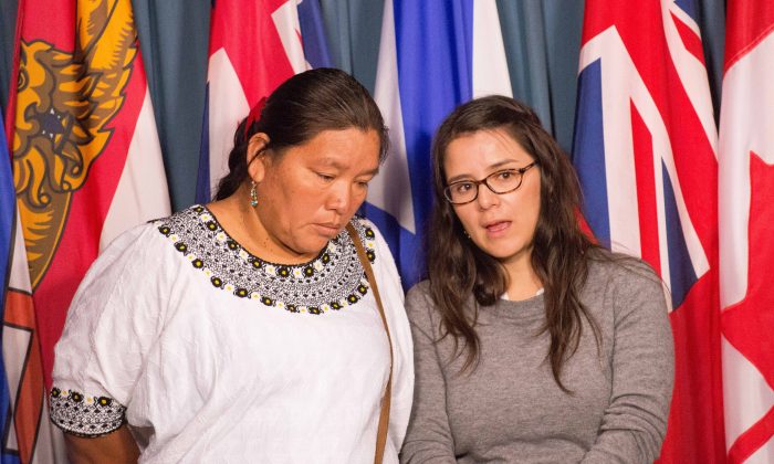 Valeria Scorza (R), deputy director for Mexican mining NGO Prodesc, translates for Angelica Choc, whose husband was killed by security staff at HudBay Minerals Fenix Mining Project in Guatemala. Choc, along with 13 other Mayan Guatemalans, is suing HudBay in a Canadian court. (Matthew Little/Epoch Times)