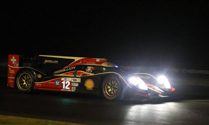 Neel Jani rounds Turn Seven in the Rebellion Racing Lola during the last hour of Petit Le Mans night practice. (Chris Jasurek/Epoch Times)`