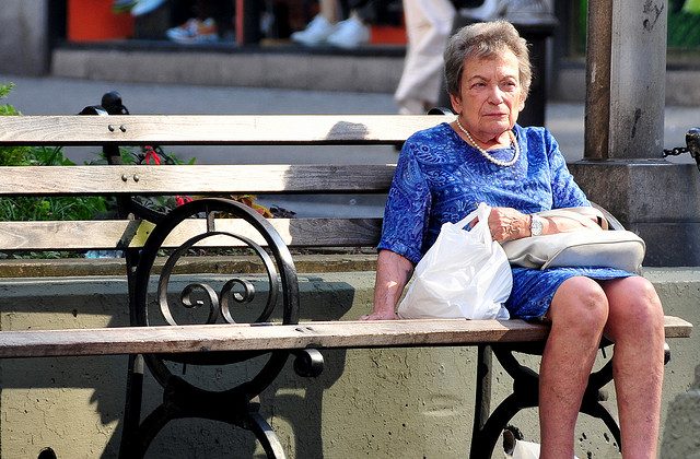Elderly woman on bench (by Ed Yourdon CC BY-SA 2.0)