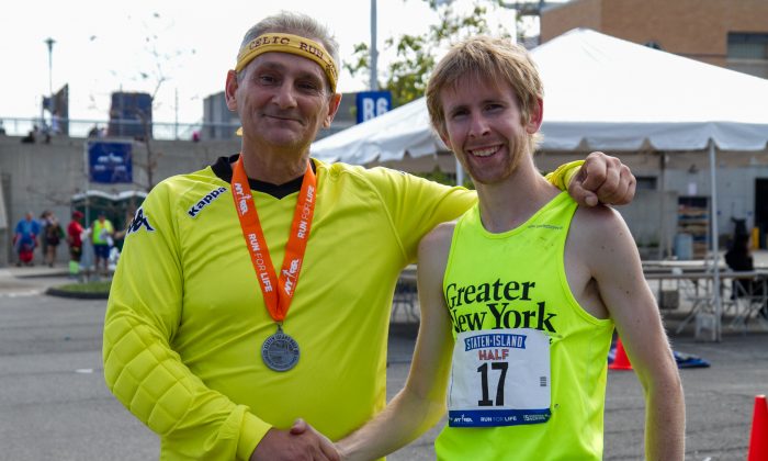 Mike Cassidy (R), third-time winner of the Staten Island Half-Marathon, is congratulated by his Staten Island friend Jim, who also ran in the Marathon in New York City, Oct. 13, 2013. (Benjamin Chasteen/Epoch Times)