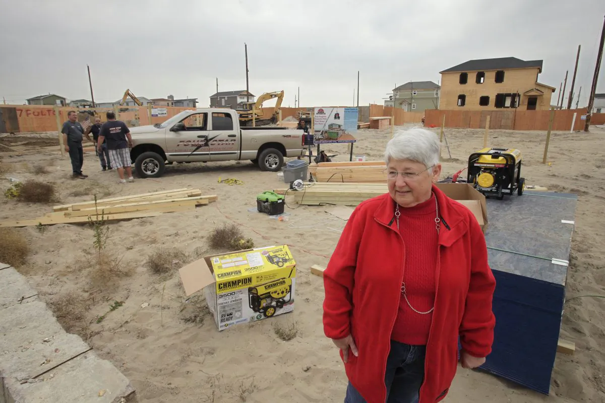 Marie Lopresti visits the site of her former house in Breezy Point, Queens, New York, Oct. 17, 2013. "I still dream of my old house," she said. "I see everything. But you have to look forward. You wish you could go back, but you can't." (Mark Lennihan/AP)