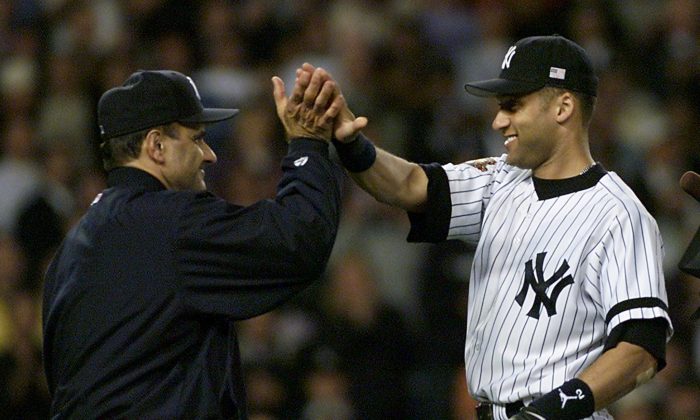 Derek Jeter's (R) play in the 2001 ALDS turned around the series for the Yankees and manager Joe Torre (R.) (Timothy A. Clary/AFP/Getty Images) 