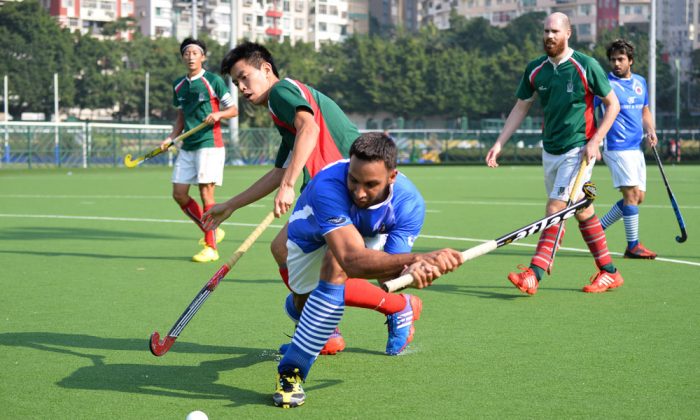 Canadian Olympian hockey player, Sukhwinder Singh Gabba representing Punjab-A hits a shot at goal during their match against KCC-A on Sunday Oct 27, 2013 at the Happy Valley Ground. Punjab-A won the match 3-1 to keep them equal top in the standings. (Bill Cox/Epoch Times)