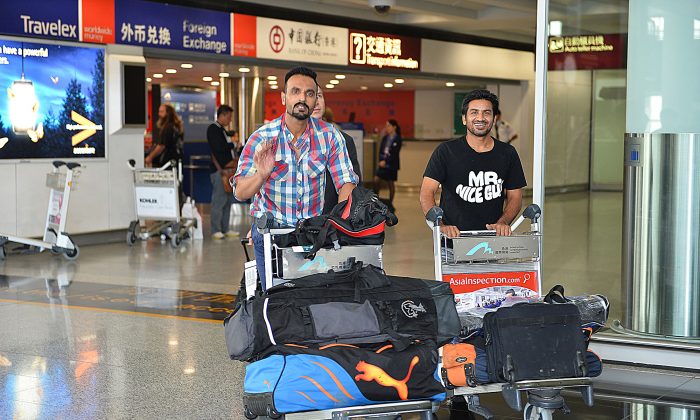 Pakistan Hockey Olympians Sohail Abbas (left) and Waseem Ahmad arrive at Hong Kong International Airport on Sunday Oct 20 to play for the Punjab Sporting Club Team in the Hong Kong Hockey Association Premier League. (Bill Cox/Epoch Times)
