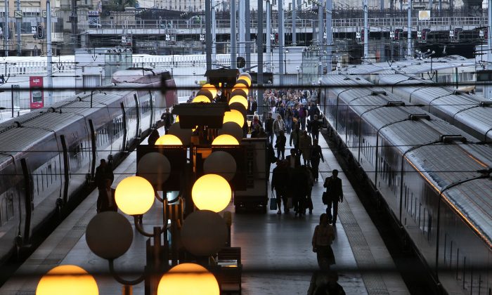 French commuters walk on a platform at Gare du Nord railway station in Paris on Sept. 7, 2010. The French commute is about to get more productive, as France 24 reported in October 2013, with a pilot program that brings English lessons aboard commuter trains. (Pierre Verdy/AFP/Getty Images)