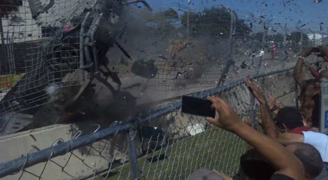 Dario Franchitti’s car disintegrates as it impacts the safety fence at Turn Five on the last lap of the second race of the IndyCar Shell and Pennzoil Grand Prix of Houston. (screen capture—click2houston.com)