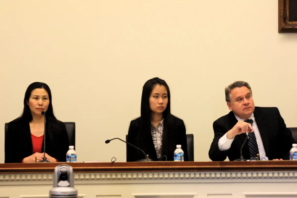 Zhang Qing (L), the wife of detained Chinese activist Guo Feixiong, with her daughter Yang Tianjiao (C), and Congressman Christopher Smith (R), at a hearing that Rep. Smith held to urge the release of Guo. (Matthew Robertson/Epoch Times Staff) 