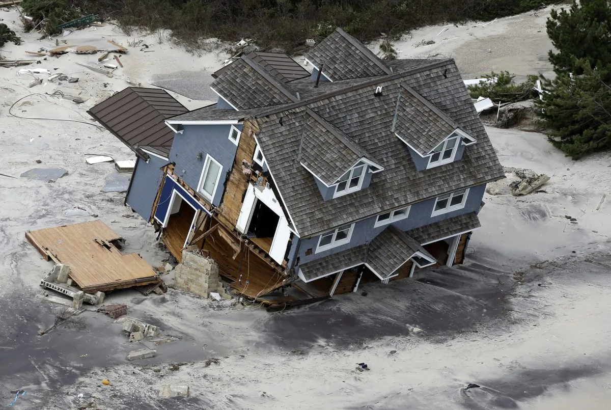 A house along the central Jersey Shore coast was destroyed by Superstorm. New Jersey got the brunt of Sandy, which made landfall in the state on Oct. 29, 2013. (AP Photo/Mike Groll)