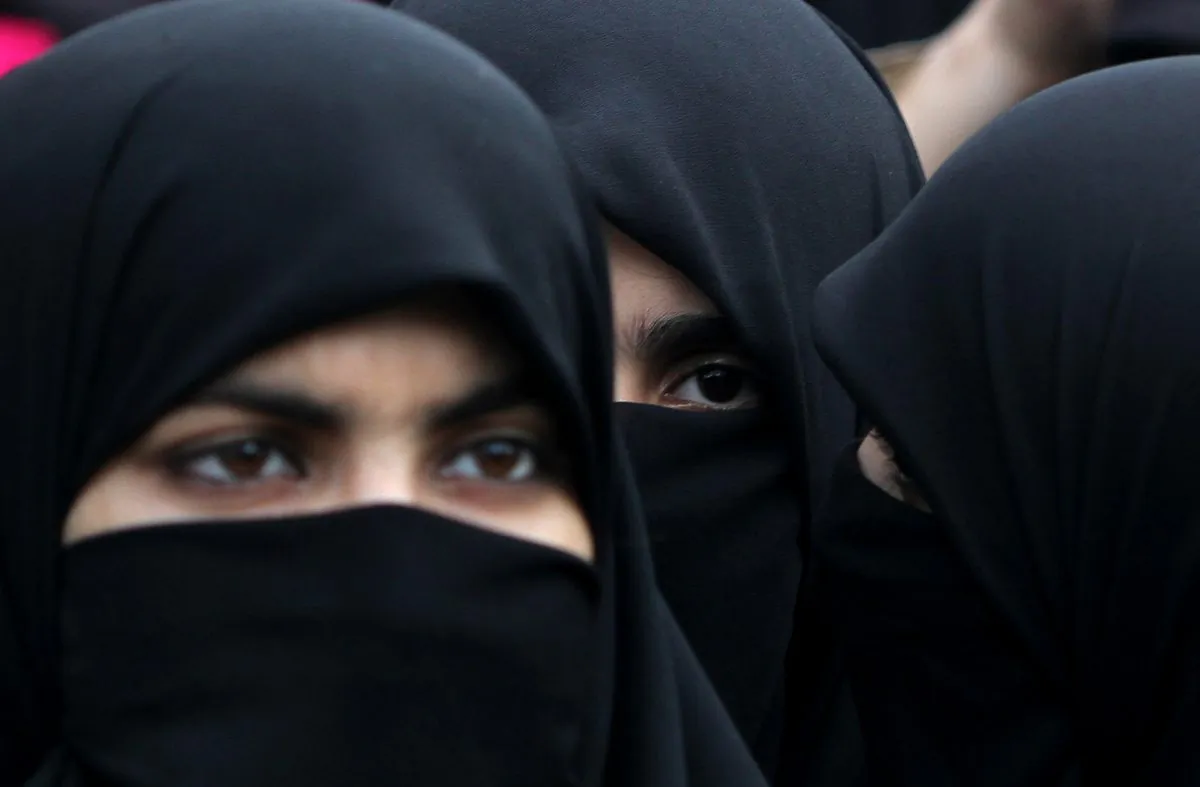 Supporters of Pakistani religious party Jamaat-e-Islami hold a rally to observe the World Hijab (veil) Day in Islamabad, Pakistan, Wednesday, Sept. 4, 2013. (AP Photo/B.K. Bangash)