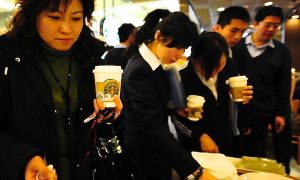 In Attack on Starbucks, Chinese Broadcaster Gets Coffee on Face