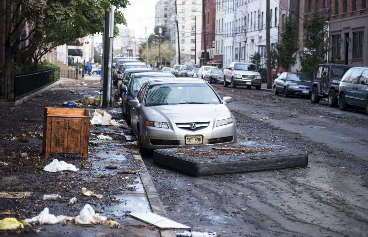 Mud and debris litter a street in Hoboken, N.J., on Nov. 1, 2012, after Superstorm Sandy. (Brendan Smialowski/AFP/Getty Images)