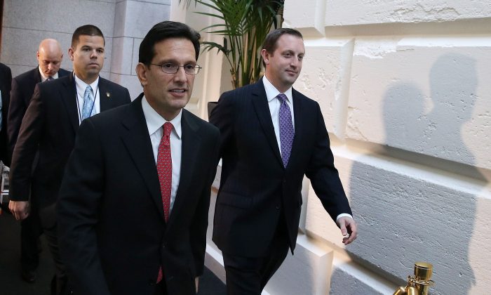 House Majority Leader Eric Cantor (R-VA) (2nd R) walks to a Republican caucus meeting at the U.S. Capitol, Oct. 15, 2013 in Washington, D.C. With the government shutdown going into the fifteenth day and the deadline for raising the debt ceiling fast approaching, Democrats and Republicans are working to come to an agreement soon on passing a budget. (Mark Wilson/Getty Images)