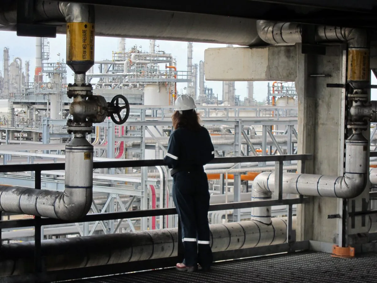 An employee of French oil company Total gathers information on the company's Texan plant in Port Arthur on June 6. Chinese hackers are targeting oil and gas companies. (Marc Preel/AFP/Getty Images)