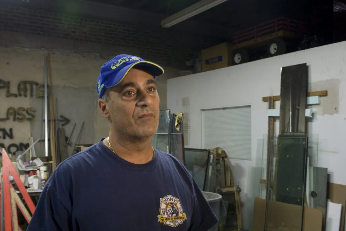 Buddy Civitano, owner of BC Glass, inside his Red Hook business. Both his business and home in Staten Island were untouched by the flooding. (Genevieve Belmaker/Epoch Times)