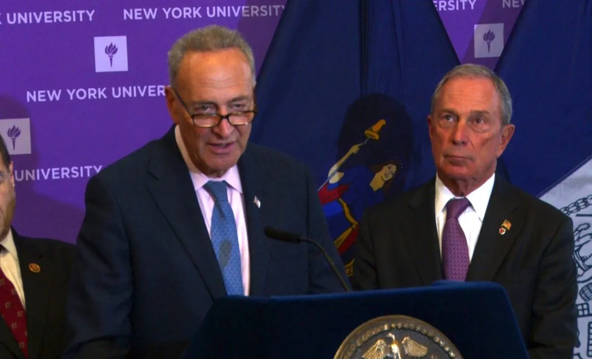 Sen. Chuck Schumer (L) at a press conference in New York City, Oct. 28, 2013. (Allen Xie/NTD Television)