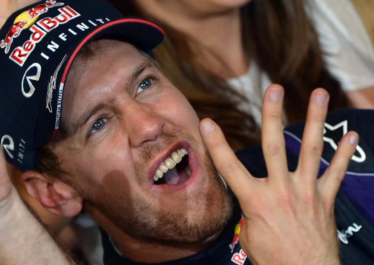 Red Bull driver Sebastian Vettel of Germany celebrates after winning the Formula One Indian Grand Prix and his fourth successive world title at the Buddh International circuit on the outskirts of New Delhi on October 27, 2013. (Manan Vatsyayana/AFP/Getty Images)