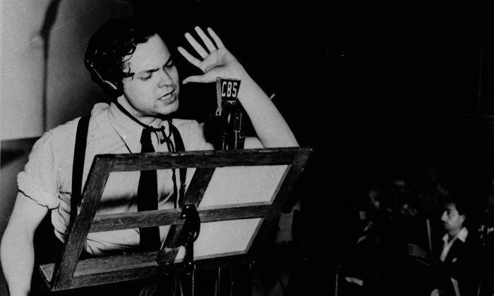 Orson Welles broadcasts "The War of the Worlds" in a New York studio at 8 p.m., Sunday, Oct. 30, 1938. The realistic account of an invasion from Mars caused thousands of listeners who had missed the beginning of the broadcast to panic (AP Photo)