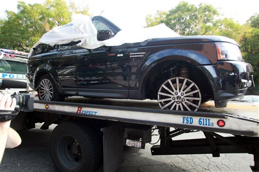 The Range Rover involved in the biker attack is being moved from the police precinct for further police investigation Saturday, Oct. 5, 2013 in New York. (AP Photo/David Karp)