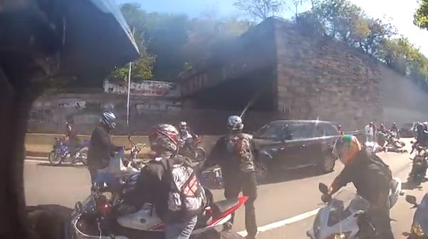 A parade of bikers surround a Manhattan family in an SUV in a violent confrontation on New York City's west side Sunday, Sept. 29, 2013. (Screenshot/YouTube)