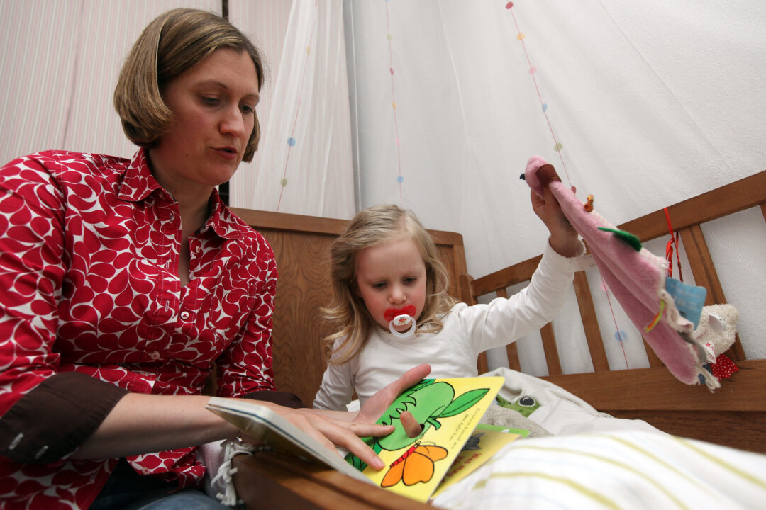 Research shows that establishing a consistent bedtime routine for a child improves behavioural problems for children. (Adam Berry/Getty Images)