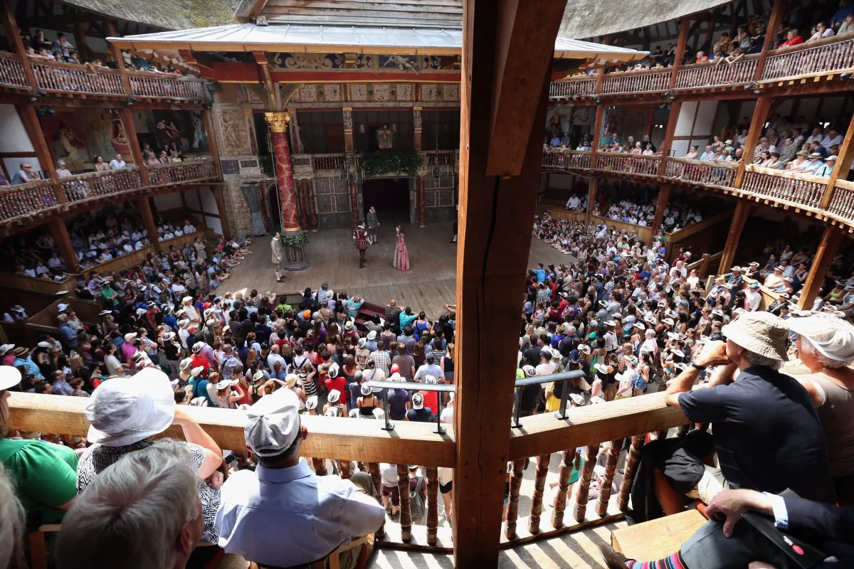 Audience members watch a production of “A Midsummer Night’s Dream” in the Globe Theatre on the South Bank of the River Thames on July 16 in London. (Oli Scarff/Getty Images)