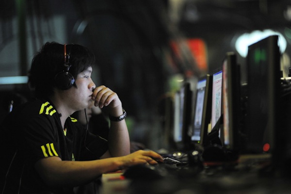This photo taken on May 12, 2011 shows people at an Internet cafe in Beijing. There are around two million public opinion analysts monitoring people's online speech, Chinese official media says. (Gou Yige/AFP/Getty Images)