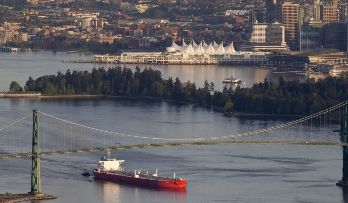 An oil tanker goes under the Lions Gate Bridge as it enters Vancouver Harbour on May 5, 2012. Oil sands opponents who have been fighting the Keystone XL pipeline project in the U.S. are training their sights on two pipeline proposals in B.C. (The Canadian Press/Jonathan Hayward)