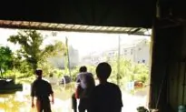 Chinese Official Fired for Getting Piggyback in Flood-Stricken Area